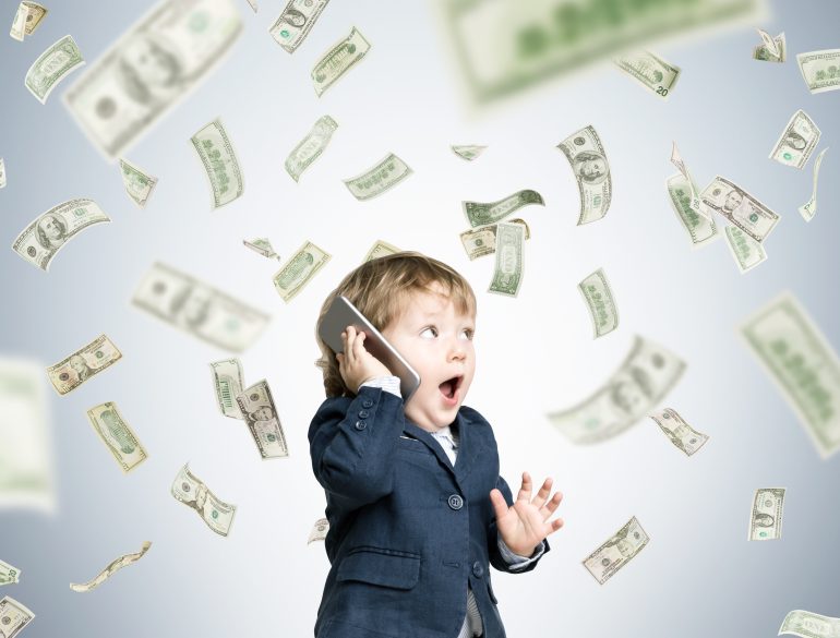 child with money raining down