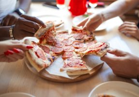 pizza being shared