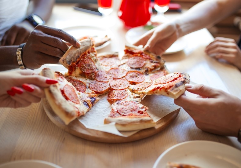 pizza being shared