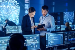 man and woman in tech room