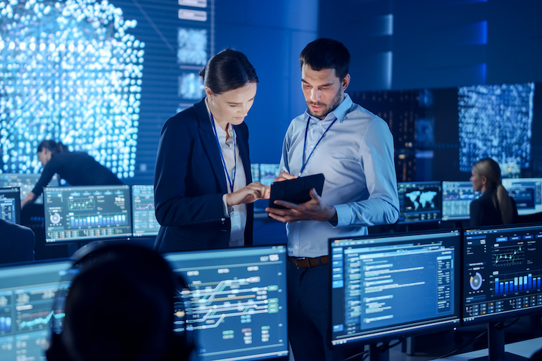 man and woman in tech room