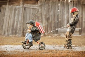 Kids on bike with rockets