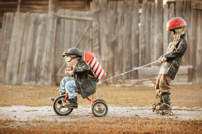 Kids on bike with rockets