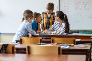 teacher with students in classroom