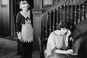 Maid eavesdropping on telephone call