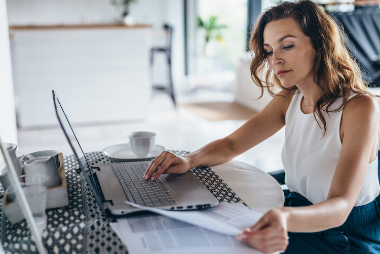 Businesswoman working on laptop.