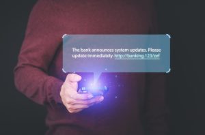 Man holding a smartphone and viewing messages on mobile phone. Fake Text message SMS scam or phishing concept.