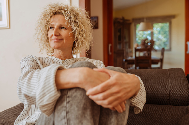 Woman sitting on couch