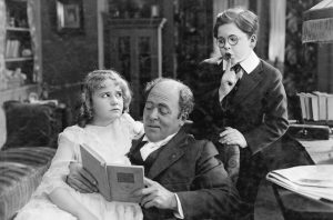 Classic black and white, father reading to kids